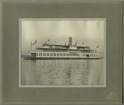 A view of the steamship "Express," owned by the Tolchester Steamboat Company, carrying passengers across the Chesapeake Bay. The company ran excursion steamships from its pier at Light Street in Baltimore, Maryland, to the Tolchester Beach Amusement Park in Kent County.