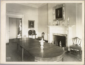 View of a dining room and fireplace in the Homewood estate. Homewood was built between 1801 and 1806 as a country home for Charles Carroll, Jr., son of Charles Carroll of Carrollton who was a signer of the Declaration of Independence. The Federal-period Palladian home was in the Carroll family until purchased by merchant William…