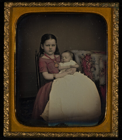 Portrait of a young girl with a baby — circa 1860