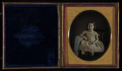 Daguerreotype portrait of a young girl seated.