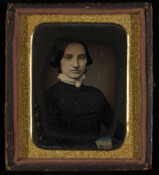 Daguerreotype portrait of an unidentified woman with cameo.