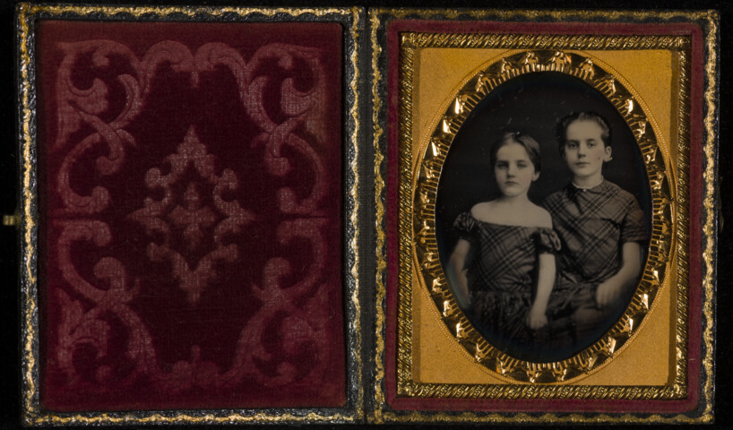 Portrait of two young children standing — circa 1850