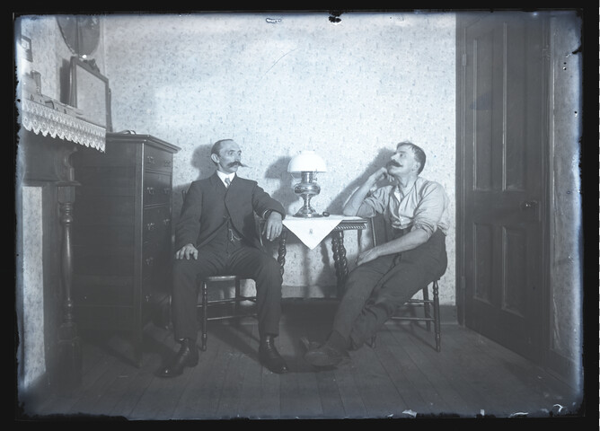 Portrait of Francois Dubas and friend seated at a side table — 1907-10-27
