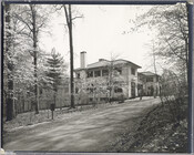 An exterior, side view of an unidentified house believed to be in the Canterbury neighborhood of Baltimore, Maryland.
