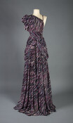 Floor-length, one-shoulder, multi-colored silk crêpe gown with a watercolor splattered pattern of purple, blue and white.