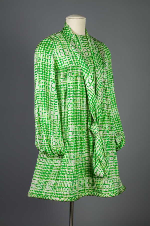 Silk minidress worn by Barbara P. Katz. When the miniskirt styles of the 1960s grew in popularity, long-time Baltimorean Barbara Katz declared she would never wear one. Despite this, Katz eventually gave into the trend and purchased this, her first minidress, designed by Pierre Cardin. From that moment on, Katz embraced higher hemlines.
