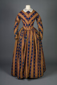 Wool printed challis dress worn by Mary Elizabeth Dorsey Farnandis (1795–1888). Fashionable paisley prints first gained popularity in the Western world during the late eighteenth century with the importation of fine goat-haired shawls from the Kashmir region of India. Nearing the mid-nineteenth century, textile manufacturers succeeded in producing paisley fabrics cheaper than those made in…