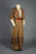 Liberty & Co. taupe silk-faille dress with paisley print at hem. Lace net with floral embroidery under-bodice with standing collar. Worn by Mary George White Bates (1885–1963). After graduating in 1907 from the Woman’s College of Baltimore City, today known as Goucher College, she enrolled at John Hopkins University and graduated in 1913 as the…