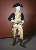 Wool Revolutionary War coat (a) and breeches (b) of Lieutenant Colonel Tench Tilghman, aide-de-camp (1776-1783) to General George Washington. Here it is displayed with a replica hat, shirt, boots, and a reproduction waistcoat (1973.69.1), which was based off of an original example worn by George Washington, and in the collection of the Smithsonian. The coat…