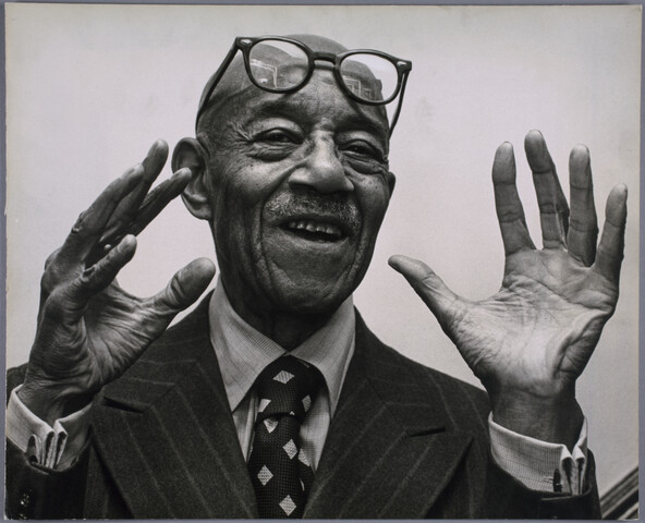Portrait of Eubie Blake with hands in air — 1972-12