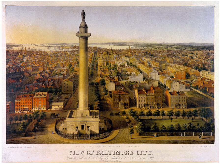 An aerial view of Baltimore, Maryland, looking south from the Washington Monument in Mount Vernon. The Baltimore Harbor is visible in the background.