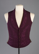Purple silk crêpe waistcoat decorated with an embroidered floral motif along the lapels, center front, and waistline. Its back and interior lining are a glazed cotton. George Coale (1819-1887) owned this garment and likely wore it in 1857 at his wedding to Caroline Dorsey, who likely embroidered the waistcoat.
