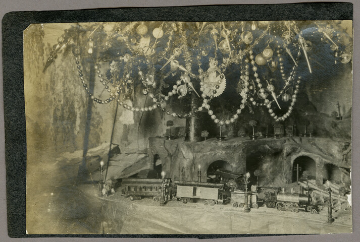 Christmas garden with tree and train — circa 1900