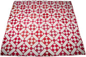 Four Lilies Quilt pieced of white and red calico floral printed cotton. Squares inked with signatures and names of cities, 36 signatures total.