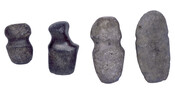 Four axe heads of varying shapes and sizes.