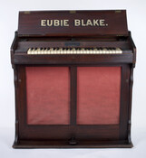 Celesta piano used for practice in hotel rooms while traveling. It belonged to Baltimore jazz musician James Hubert "Eubie" Blake (1887-1983). Made by Mustel & Company in Paris, France.