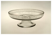 An unusual handblown and cut glass English tazza (cake stand) from the early-19th century. The piece came from the Governor Thomas Johnson Family.
