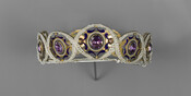 This diadem of amethysts and pearls was given to Elizabeth Patterson Bonaparte (1785-1879) by Prince Jerome Bonaparte (1784-1860) and was part of a large parure with earrings, a bracelet, a pendant and additional amethysts that were set into a bracelets in London. In 1869, Elizabeth recorded, "This Parure sent 1805 by Prince Jerome." Jerome probably…