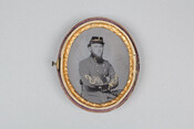 A cased, oval-shaped portrait of Edward Rutland Dorsey, a Confederate Lieutenant Colonel in the American Civil War. Dorsey sits wearing his uniform with arms crossed at his chest. The gold accents on his hat and coat appear to have been hand-colored.