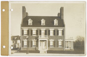 A view of the facade of Bridges House, taken about 150 feet in front of the building looking east. The three story brick house was located in the Roland Park-Guilford district of Baltimore, Maryland.