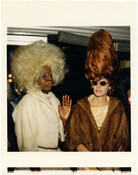 Two people attending the movie premiere of Hairspray, written and directed by Baltimore-native John Waters. The premiere was held at the Senator Theatre, a historic Art Deco movie theater located in the Govans neighborhood of Baltimore, Maryland.