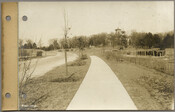 View looking north along the east side of the 3900 block of Greenway from a point about 200 feet south of East 39th Street during the Roland Park Company’s development of the Guilford neighborhood in Baltimore, Maryland. Guilford mansion – the former country seat of the Abell family – is visible in the center background.