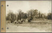 Roland Park Company workers grading sidewalks on the east side of Greenway, 75 feet north of modern-day Kemble Road in the Guilford neighborhood of Baltimore, Maryland. The Guilford mansion – the former country seat of the Abell family - is visible to the northeast (right background).