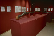 The image depicts a work on display in "Mining the Museum," a 1992-1993 installation by artist Fred Wilson at the Maryland Historical Society. In Mining the Museum, Wilson used the museum's collections to confront and challenge perceptions about history, culture, and race. It was a joint exhibition with The Contemporary in Baltimore. The item on…