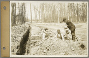 Men laying water pipe along the west side of the 4200 block of Greenway in Baltimore, Maryland during the Roland Park Company’s development of the Guilford neighborhood. View is to the north.
