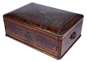 Decorative game box with brass, inlaid mother of pearl, veneers. Filled with game pieces including dice, chess board, chess pieces, and more. Likely bought in Paris by Jérôme "Bo" Napoléon Bonaparte (1805-1870).