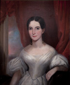 Half-length portrait shows Martha Elizabeth Harris (1913-1992) (Mrs. Benjamin Gwinn Harris) with dark brown hair, pulled back with long curls at sides, wearing low-necked white dress with pleats and full sleeves. She is seated on black-upholstered empire sofa.