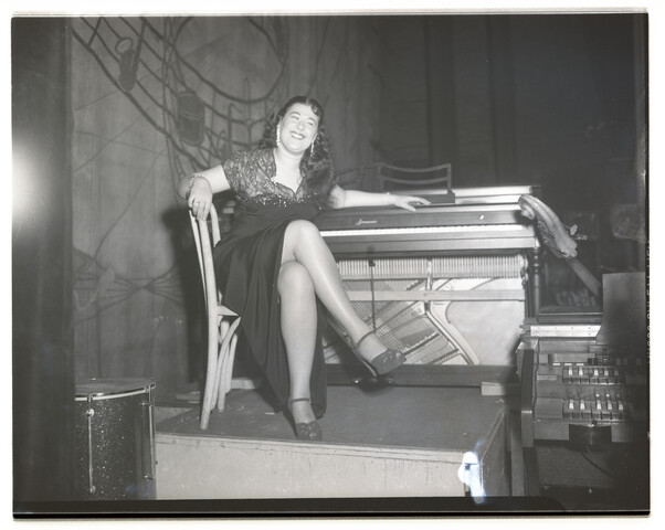 Performer at organ seat — 1950-12