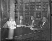 Four men of the Afro-American newspaper offices in Baltimore, Maryland. Sitters include (from left to right): an unidentified man, George Murphy, Carl Murphy, and Arnett Murphy.