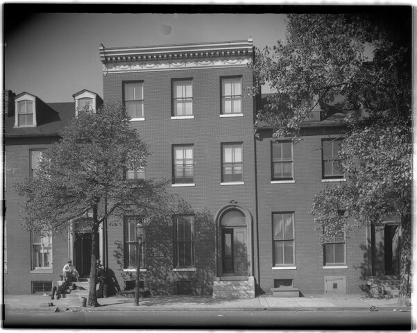 Row houses with men on stoop — 1949-11