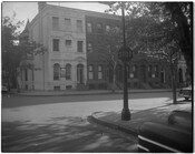 A street view of row houses on an unidentified street corner, possibly Linden Avenue, in Baltimore, Maryland.
