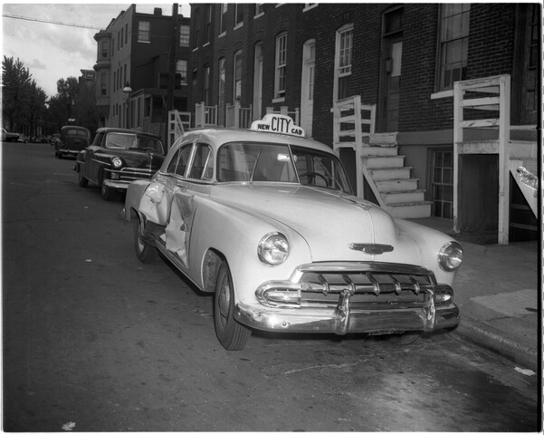 Damaged city taxicab on Amity Street — circa 1953-04