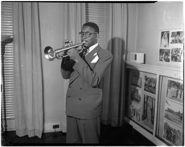 Man playing trumpet — circa 1949-12