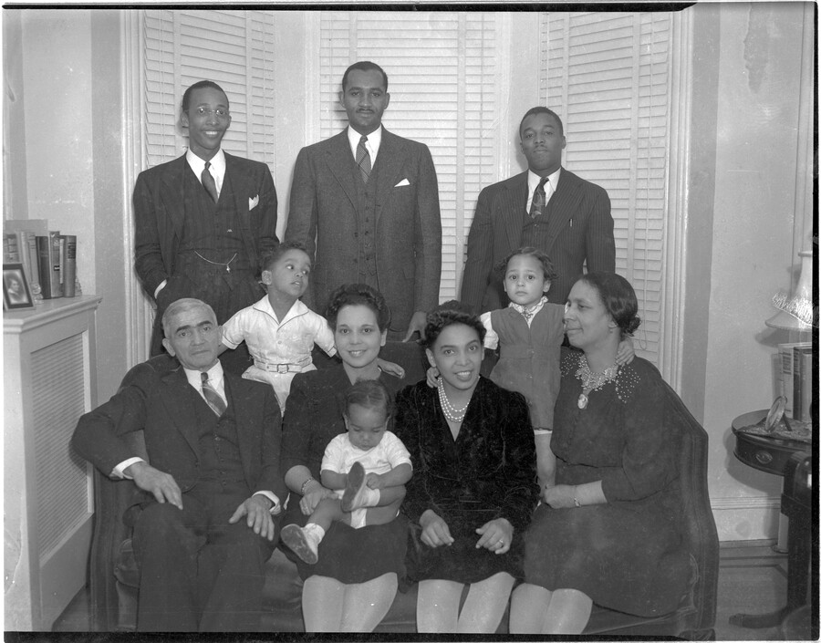 Portrait of the Jackson and Mitchell family, including Keiffer Jackson (seated far left), Clarence Mitchell III (standing, second from left), Juanita Jackson Mitchell (seated, third from left), Virginia Jackson Kiah (seated, fourth from left), Lillie May Carroll Jackson (seated, far right), Clarence Mitchell Jr (standing, center), and Keiffer Mitchell (seated on Juanita Jackson Mitchell's lap).