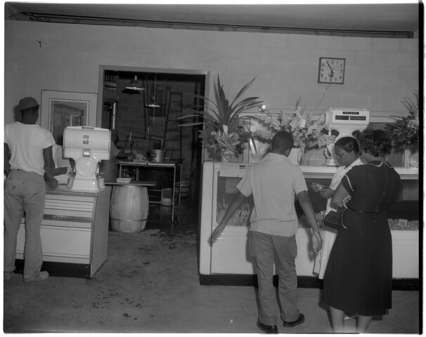 Customers inside a delicatessen or grocery — 1953-10