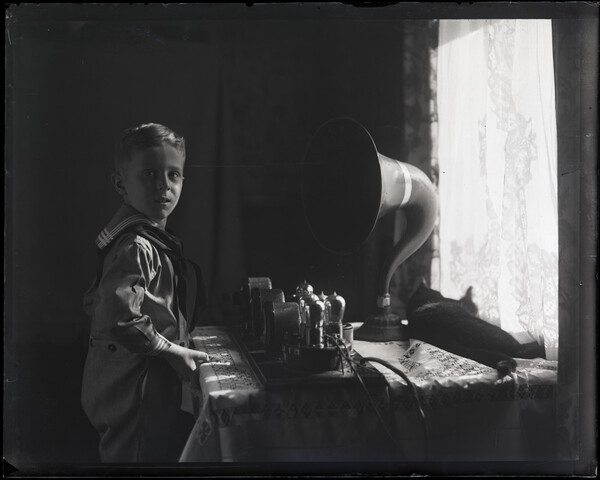 Boy scout with phonograph — circa 1945