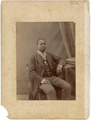 Undated, three-quarter length portrait of C.T.O. King seated at a table. A native of Sierra Leone, King moved to Liberia in 1867 and served numerous political positions until eventually being elected Mayor of Monrovia, the capital of Liberia, in 1884. He was continually re-elected until 1890, during which time he also served as an agent…