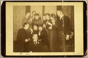 Group portrait of the Baltimore, Maryland, photographer Emily Spencer Hayden, her husband Charles, and friends eating bananas.