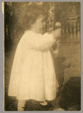 Young Ruth Hayden (Wanzer) playing with toy — circa 1897