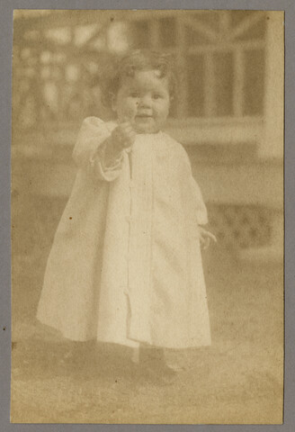 Portrait of young Ruth Hayden (Wanzer) outside the family home — circa 1897