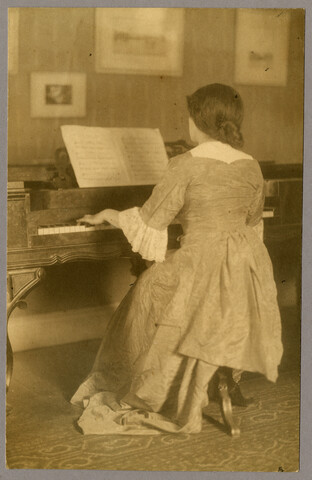 Ruth Hayden (Wanzer) playing piano — circa 1920