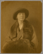 Portrait of Ruth Hayden (Wanzer), daughter of Baltimore, Maryland, photographer Emily Spencer Hayden, wearing a hat, fur trimmed coat, and fur muff.