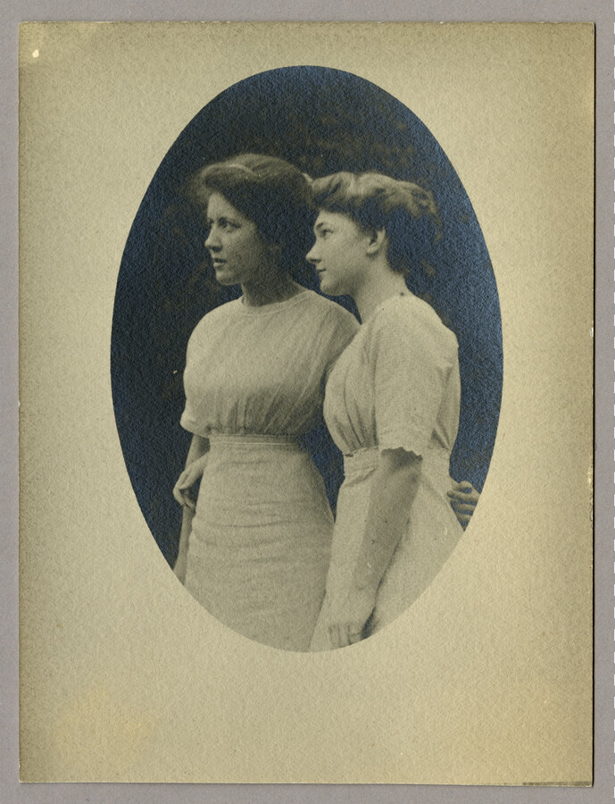 Portrait of Baltimore, Maryland, photographer Emily Spencer Hayden's daughter Ruth and a friend. The two women are wearing white dresses with their arms around each other's waists. Verso transcription: Ruth Hayden on left and ?