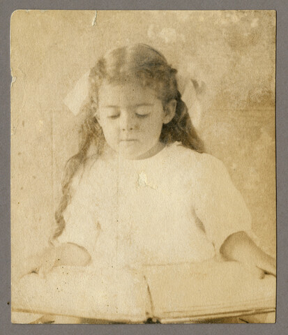 Portrait of young Catherine Spencer Hayden (Stewman) reading a book — circa 1907