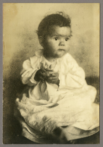 Portrait of young Anna Bradford Hayden holding toy — circa 1905