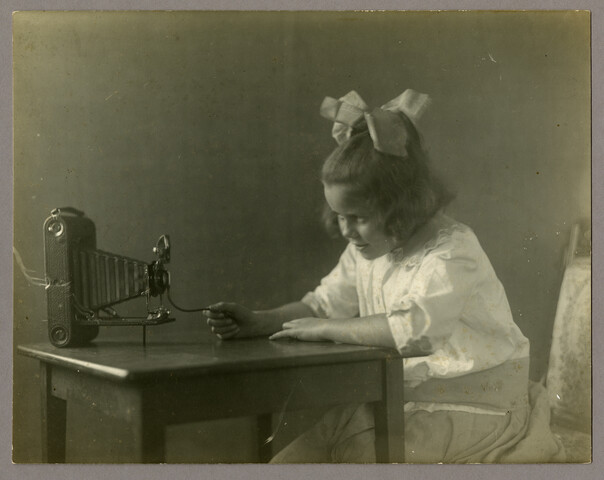 Photograph of Anna Bradford Hayden with camera — circa 1912